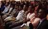 A group of young people smiling in an auditorium for the 2018 Baobab Summit, 5 x 3
