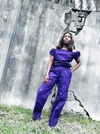 Woman in a purple jumpsuit 