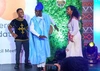 Some young people dancing on stage at a Mastercard Foundation Scholars Program council meeting