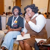 Two young women having a discussion in a group setting on Day 3 of the Baobab Summit 2025