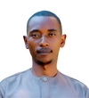 George Niyingabira wearing a light blue button up shirt