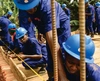 Construction workers building a wall