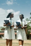 Two young women walking together at the Gashora Girls Academy Science and Technology 2024