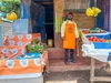 Erick standing at his grocery stall