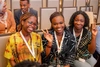 A group of young women taking a group photo outdoors at the Baobab Summit 2022