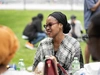 A young woman participant of the North American Mastercard Foundation Alumni Network socializing outdoors at their summer social in 2025.