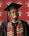 Nkosinathi smiling to camera wearing graduation clothes