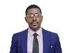 Debaba Maarifa in a smart blue suit and tie