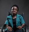 Stephanie Egharevba , Lead Diversity and Inclusion wearing a dark teal coloured short sleeved blazer with a black shirt underneath