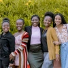 A group of women smiling at the camera.