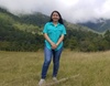 Lynda Alvarado standing in a field