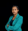 Valentine Uwimpuhwe wearing a bright teal blazer with a dark blue top underneath