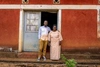 Oliver standing outdoors with his mother