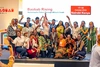 A group of students on stage with Ann Cotton at the Baobab Summit 2025