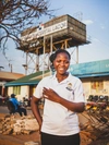 Lucy Aciro standing outdoors and smiling