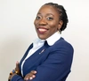 Linda Osodo smiling to camera wearing a smart suit