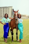 Two women stood with a horse