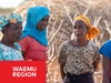 A group of women from the WAEMU region standing outdoors in brightly coloured clothing