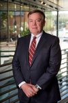 Man in a suit looking to camera