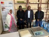 Yemariamwork Alemayehu (left) showcases her products in Addis Ababa with Kifiya and Foundation representatives