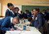 Schoolchildren working around a desk.