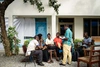 A group of people sitting outside.