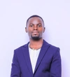Owekitinisa Sylas Ruhweza Atwoki, Makerere University in a bright blue blazer with a white shirt