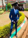 Kuol on his graduation day at Moi University wearing a dark blue suit