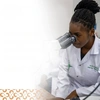 The AHEFT Prize Recognition Ceremony Poster with an image of a young woman looking into a microscope wearing a white lab overcoat.
