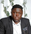 Alpha Ngwenya ASU 2019 Mastercard Foundation Alumni in a black blazer with a white button up shirt