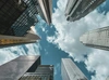 View from the ground of skyscraper buildings looking up towards the sky