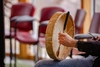 Person holding a drum