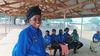 Jeane Mukhisa (foreground) works with the Tumaini Mother-to-Mother Group to support young mothers and other out-of-school youth to return to learning and succeed.