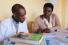 Sister Umwali (left) provides feedback working with a teacher at her school.