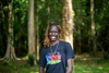 Apat Bul Kiir Aguer at EARTH U in Costa Rica, smiling outdoors 