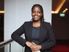Vanessa Ishimwe wearing a black blazer and shirt 