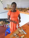 Cecilia Lemon mending sandals in a workshop