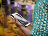 A woman holding a mobile device, Ghana Mastercard Foundation Scholars Program, 2017.