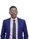 Debaba Maarifa in a smart blue suit and tie