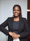Vanessa Ishimwe wearing a black blazer and shirt 