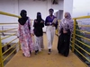 Nyibol Racheal refugee mental health network walking with three other women, having a discussion, February 2026.