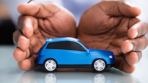 hands around toy car
