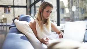 Young woman looking at her laptop 