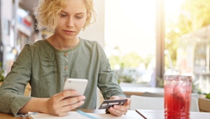 woman on phone with calculator