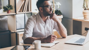 pensive man at desk