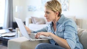 woman checking laptop
