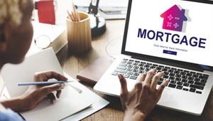 woman looking at mortgages on a computer