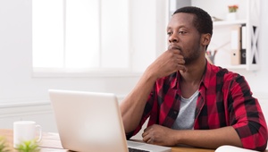 serious man on laptop