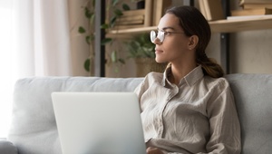 woman on laptop thinking