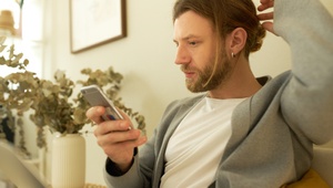 Man on his phone at home
